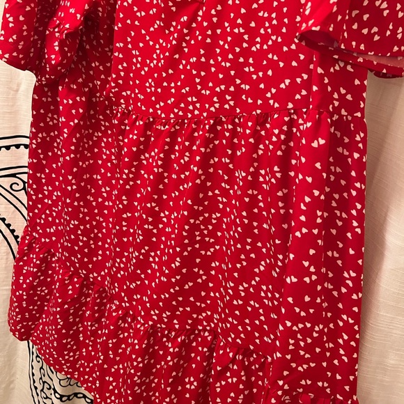 Red dress with white hearts and ruffles on the bottom part of dress. - Picture 3 of 5